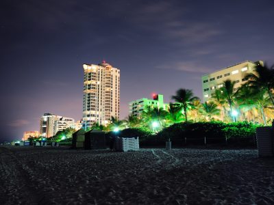 Miami south beach at night with hotel buildings