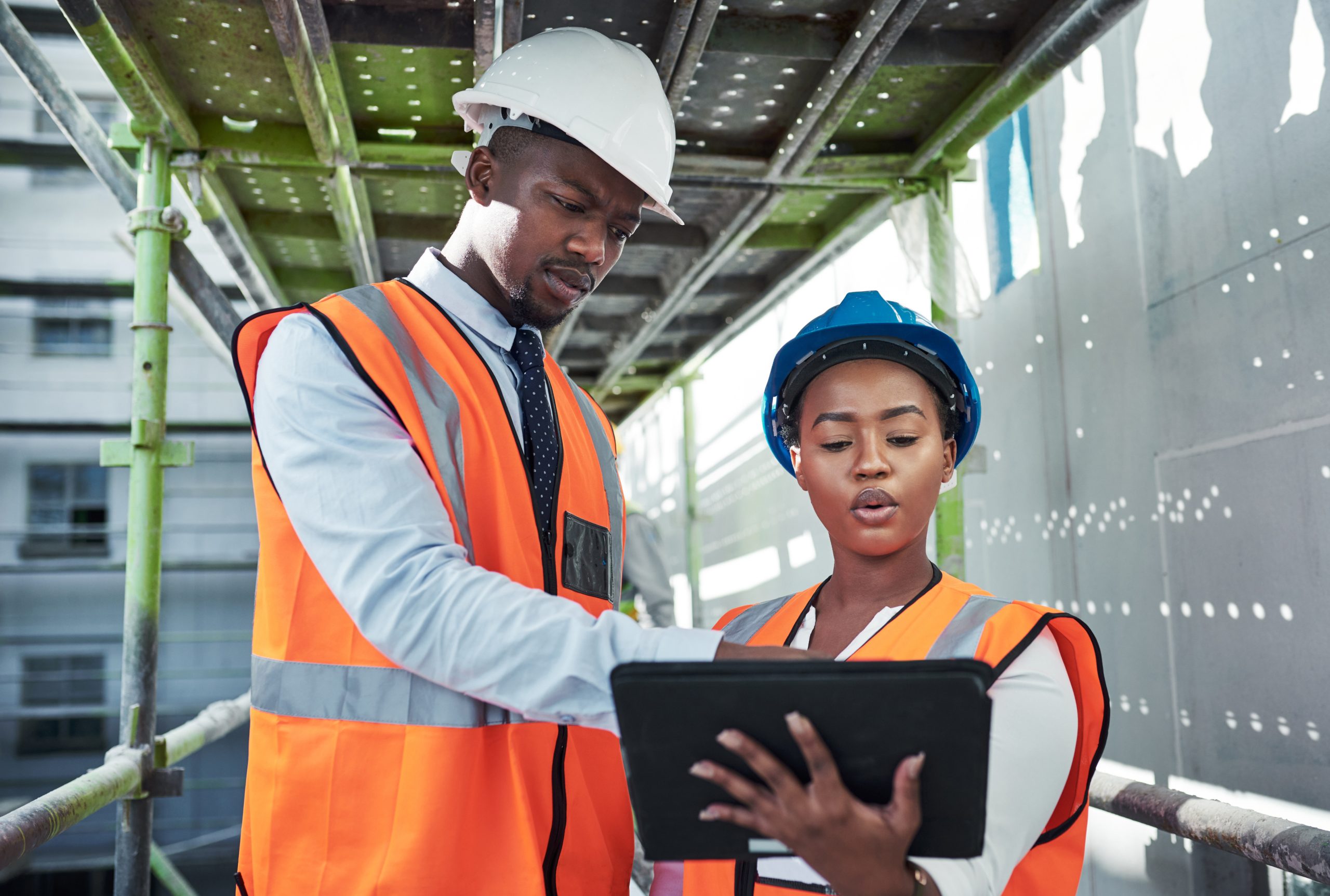 Team inspecting a building with a tablet
