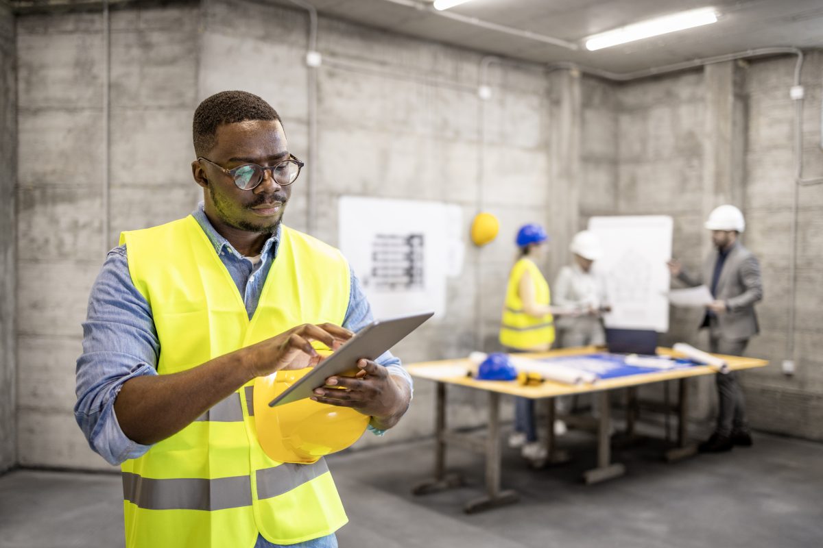 Engineer with a tablet on site